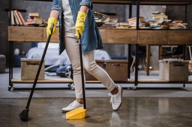 Woman sweeping floor  clipart
