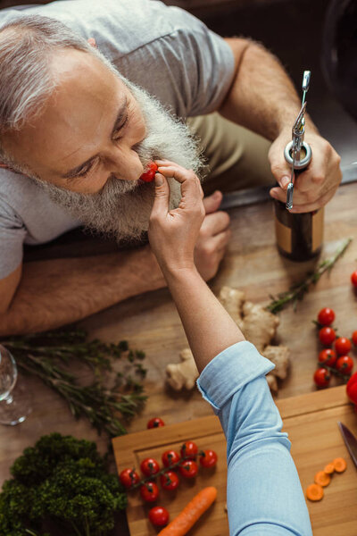 Woman feeding man