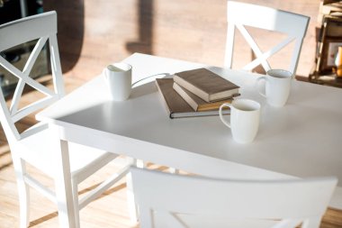 Books stacked on table  clipart