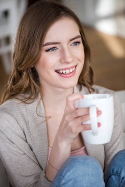 Woman holding cup clipart