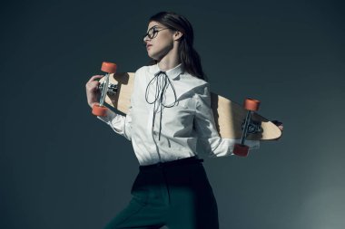 hipster woman with skateboard
