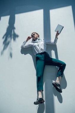 hipster woman holding digital tablet