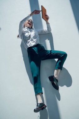 hipster woman holding digital tablet