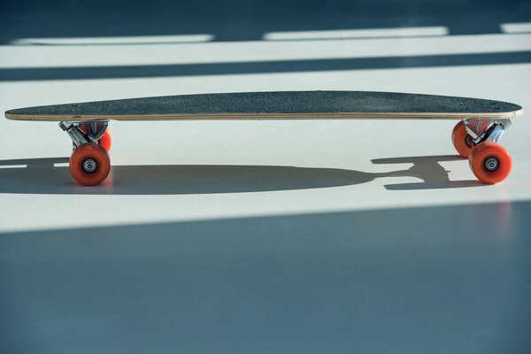 skateboard with orange wheels