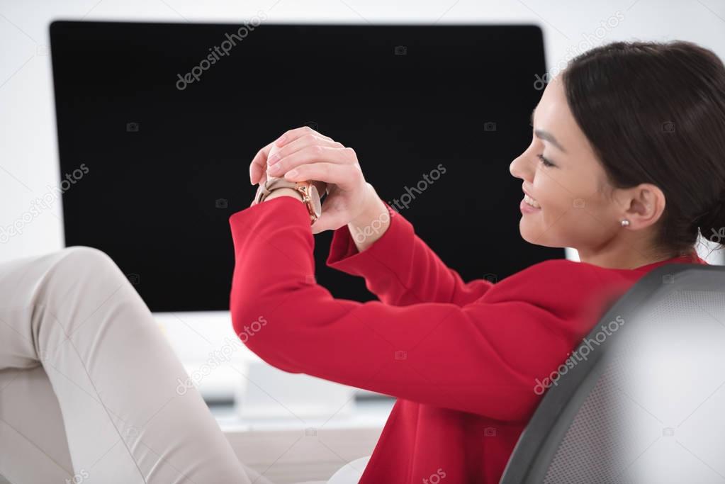 businesswoman looking at watch