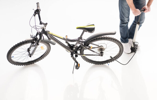 Man inflating bicycle tire