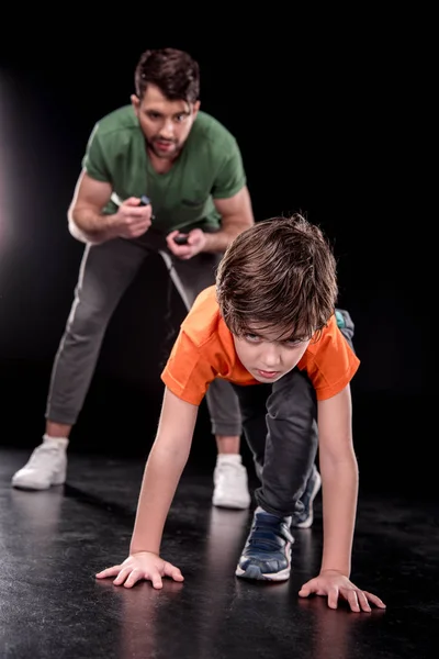 Man and boy training together — Stock Photo, Image