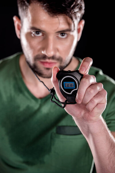 man holding stopwatch