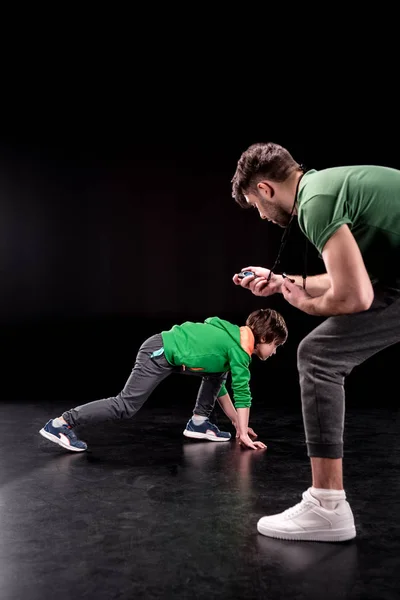 Man and boy training together — Free Stock Photo