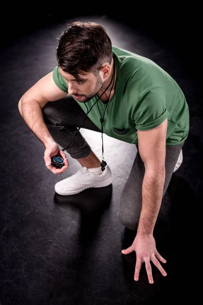 Man holding stopwatch — Stock Photo, Image