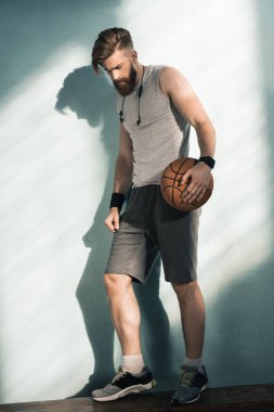sporty man with basketball ball clipart