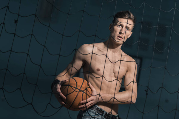 sporty man with basketball ball