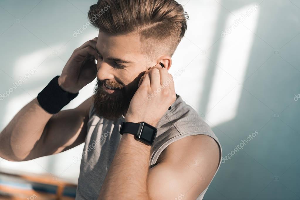 sporty man listening to music