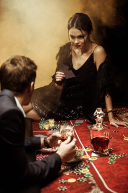 Couple playing poker clipart