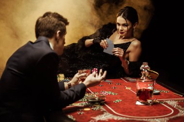 Couple playing poker clipart
