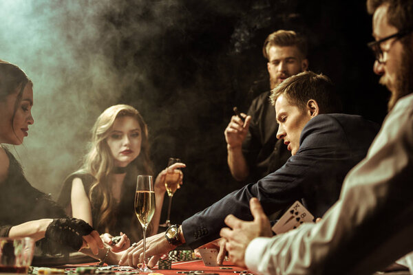 young people playing poker