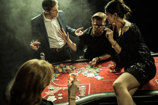 young people playing poker