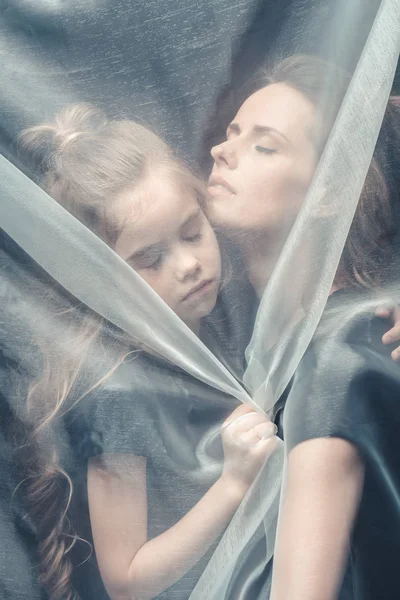 Tender daughter and mother hugging — Stock Photo, Image