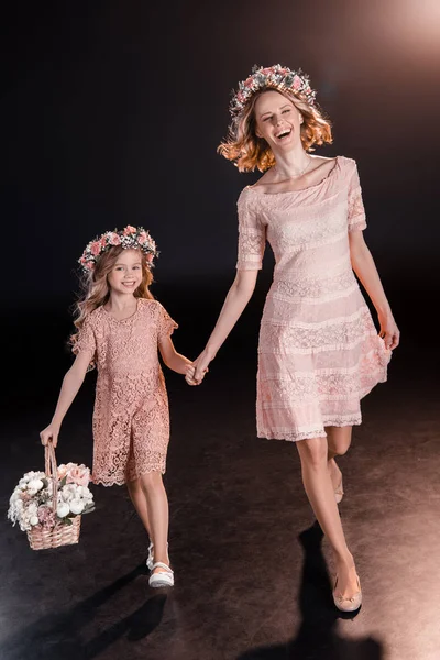 Mother and daughter in wreaths — Stock Photo, Image