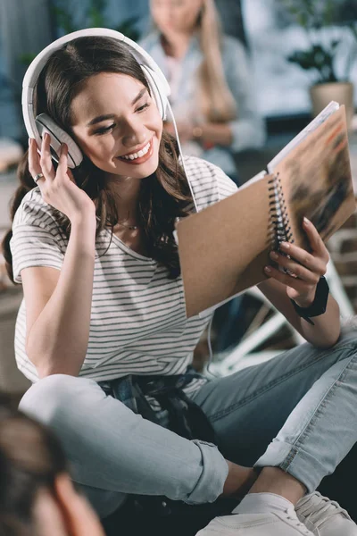 Girl reading copybook — Stock Photo, Image