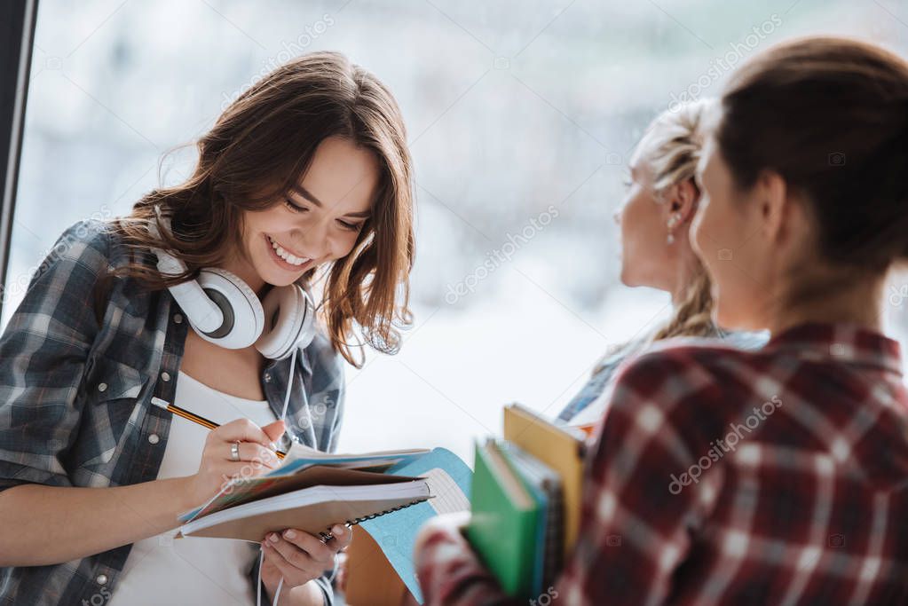 young students with textbooks 