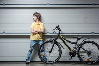 Adorable boy with bicycle clipart