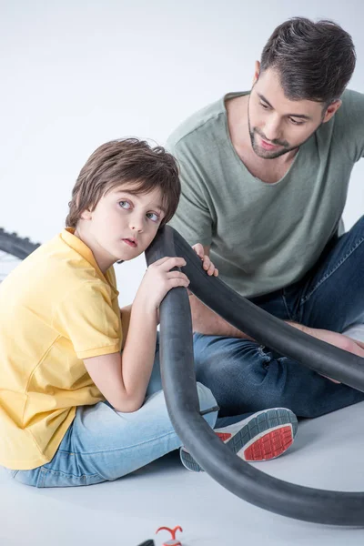 Father and son repairing bicycle — Free Stock Photo