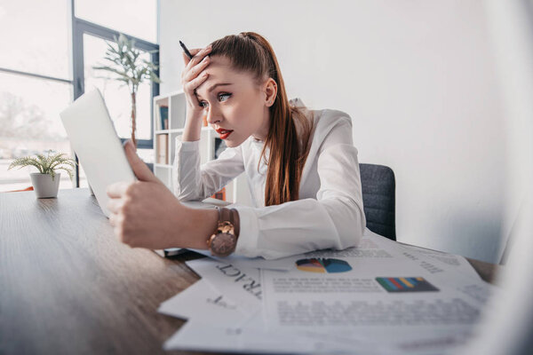 stressed businesswoman with laptop