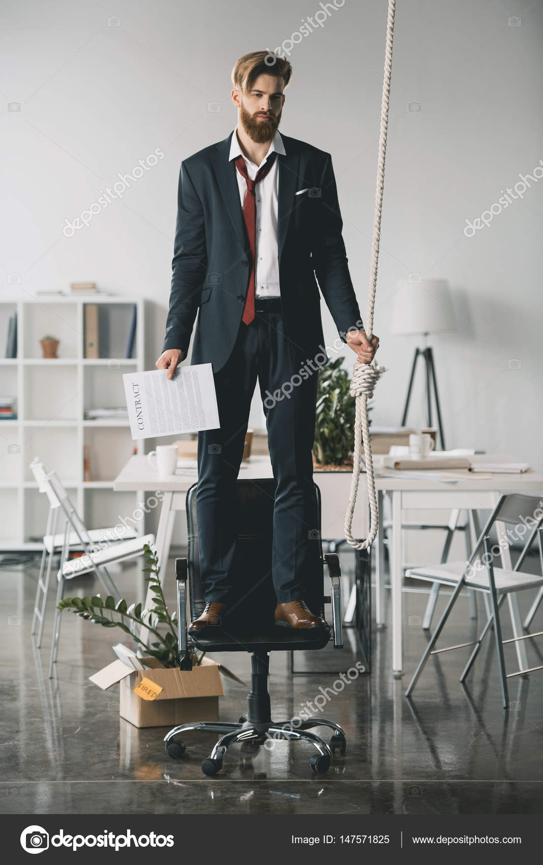 Businessman trying to hang himself — Stock Photo © ArturVerkhovetskiy