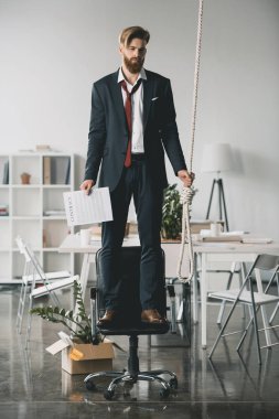 Businessman trying to hang himself  clipart