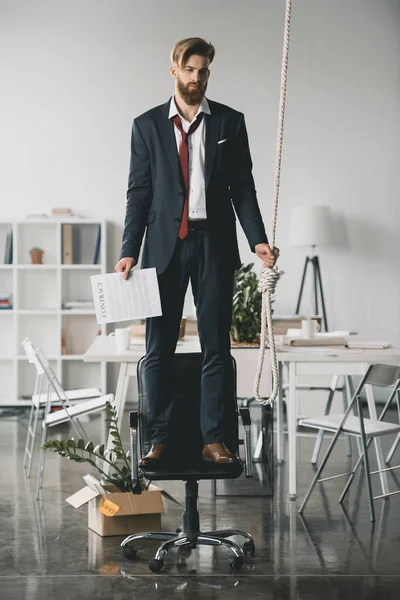 Businessman trying to hang himself — Stock Photo, Image