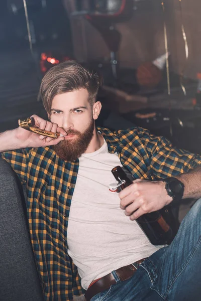 Young man with party blower — Stock Photo, Image