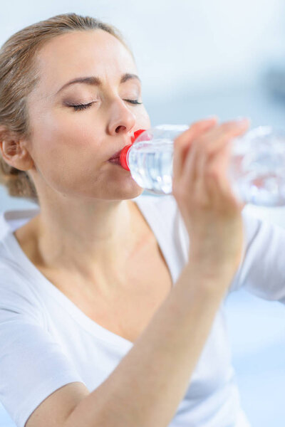 sportswoman drinking water
