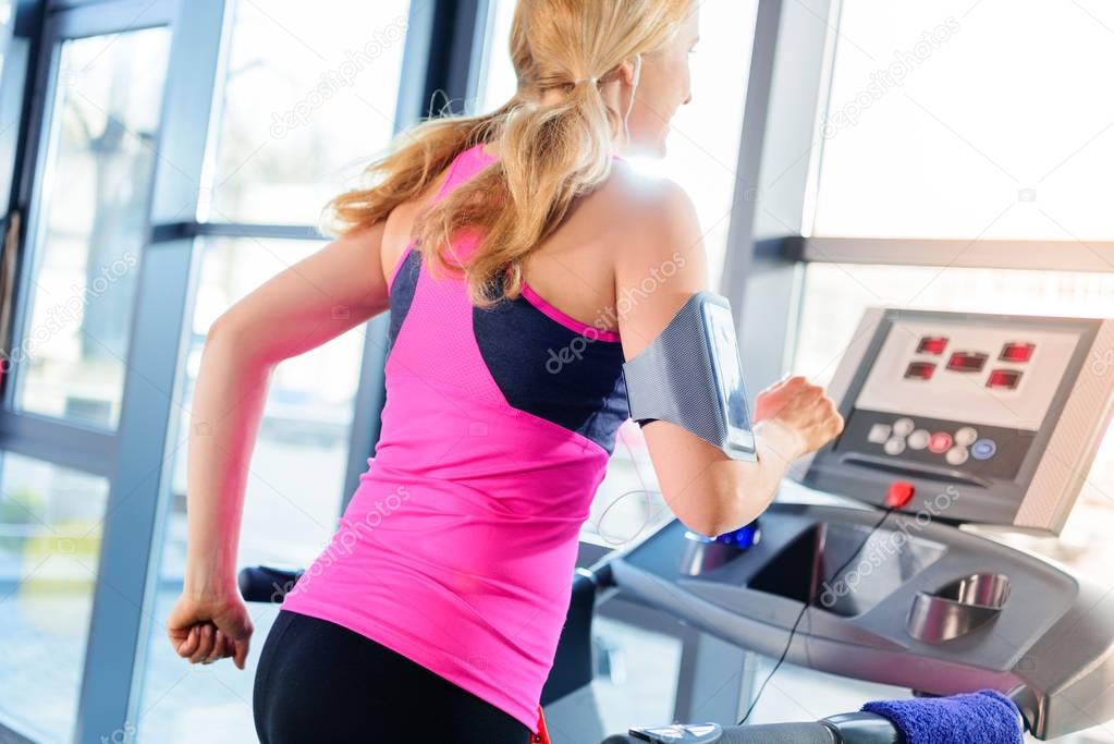 Sporty woman on treadmill 