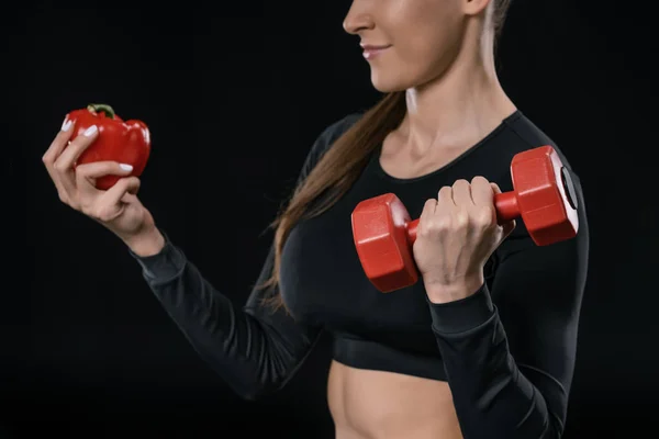 Sportswoman with pepper and dumbbell — Stock Photo, Image