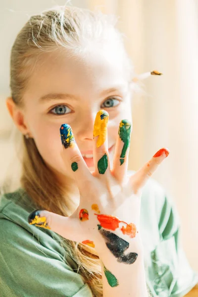 Girl with painted hand — Stock Photo, Image