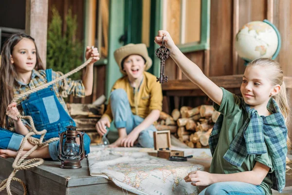 Little travelers with map — Stock Photo, Image