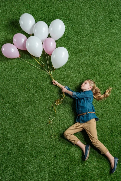 Little girl with balloons — Stock Photo, Image