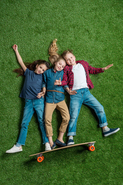 children standing on skateboard