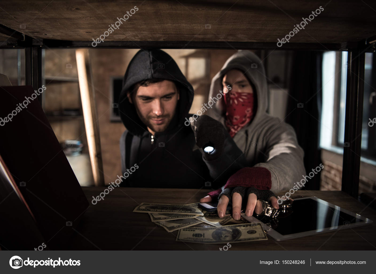 Robbers stealing money Stock Photo by ©ArturVerkhovetskiy 150248246