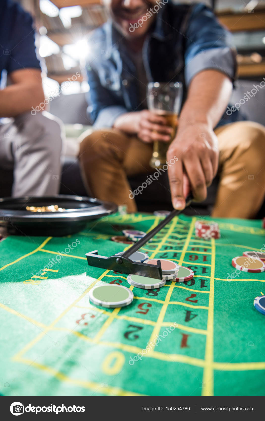 Men playing roulette game — Stock Photo © ArturVerkhovetskiy 150254786