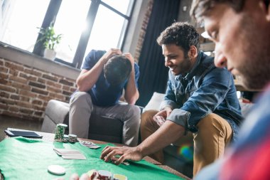 Men at gaming table clipart