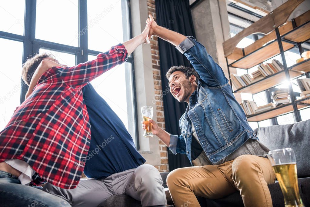 excited men giving highfive.