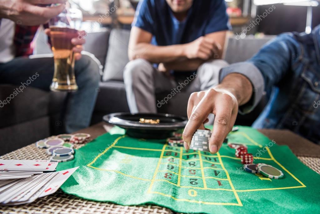 Young men playing roulette game. young people having fun concept