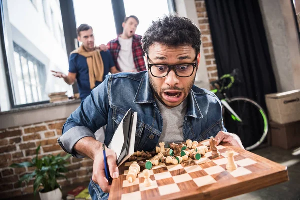 Man holding chess board — Stock Photo, Image