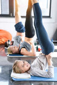 People doing gymnastics at fitness studio