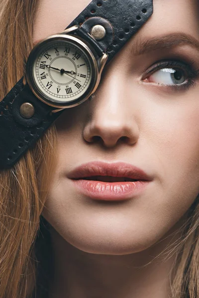 Girl hiding eye with vintage watch — Stock Photo, Image