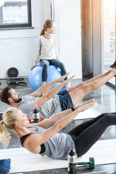 People doing gymnastics at fitness studio