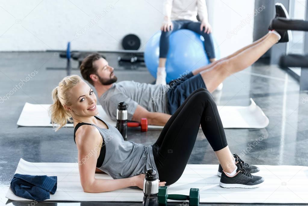 People doing gymnastics at fitness studio