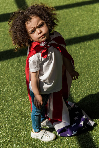Girl with american flag superhero cape